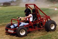 A Grass Kart kicking up the dust